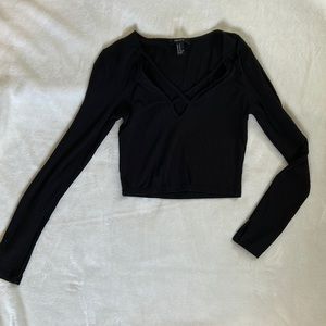Long sleeve black crop top.